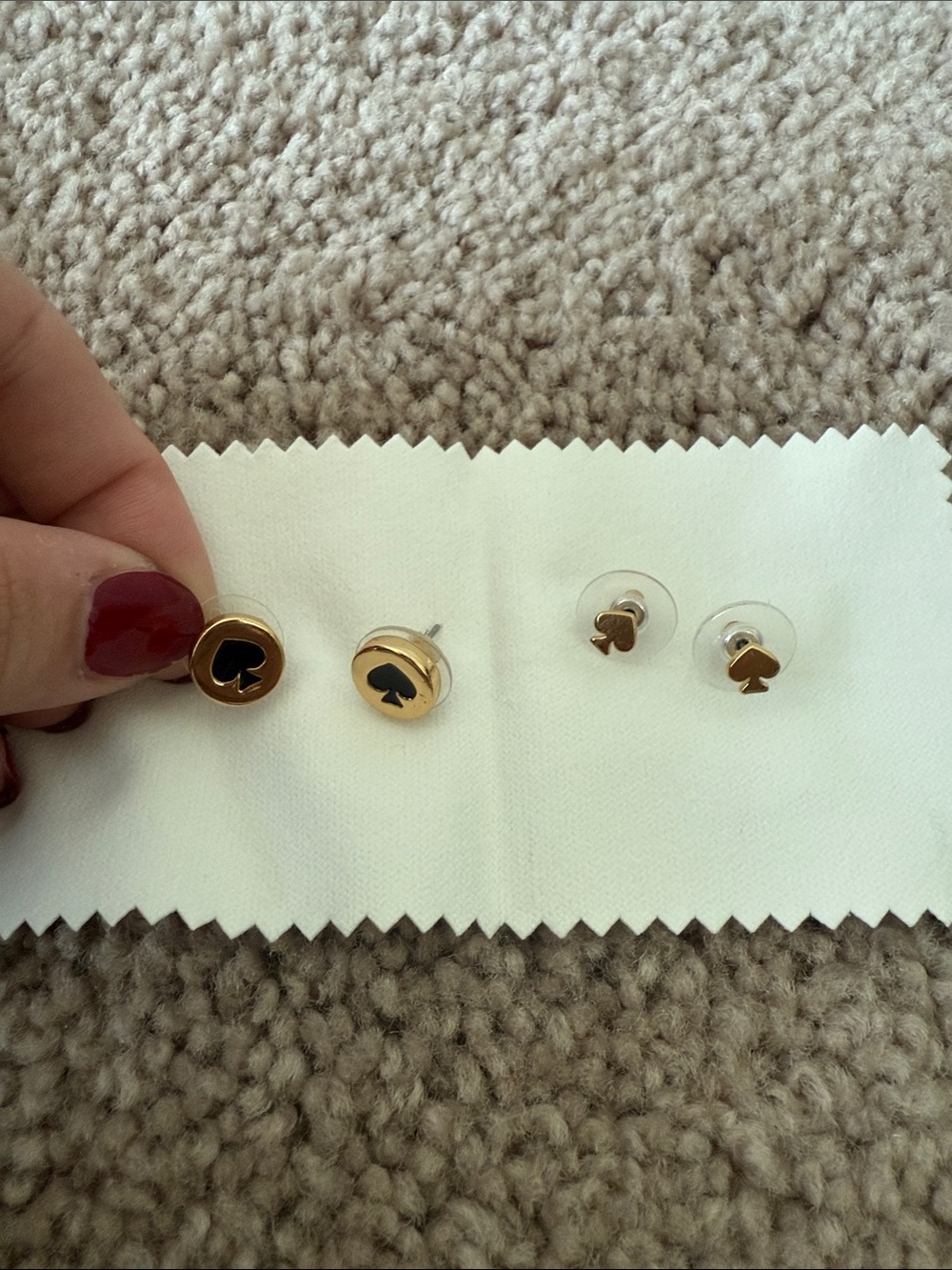 Two pairs of Kate Spade earrings. Gold and Black